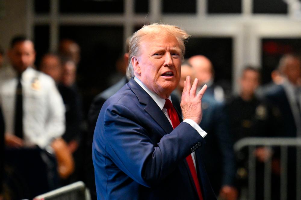 Trump judge sets March date for historic criminal trial