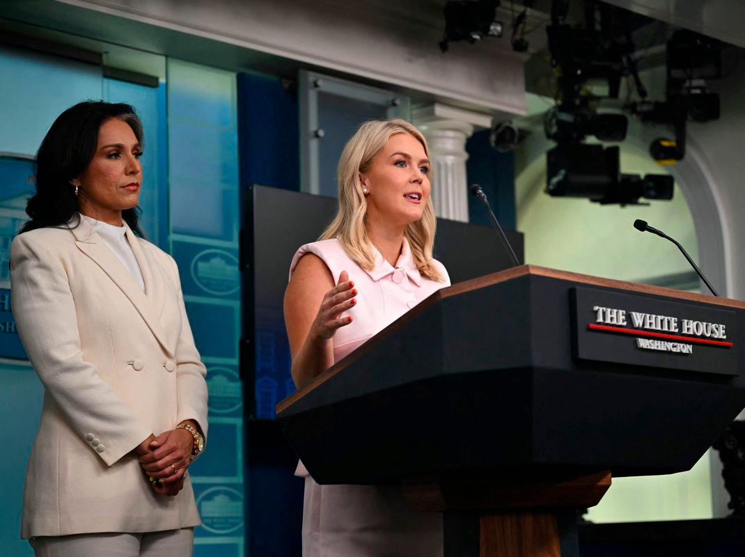 White House Press Secretary Karoline Leavitt speaks as US Director of National Intlligence Tulsi Gabbard looks on during a press briefing in the Brady Briefing Room at the White House - AFPPix