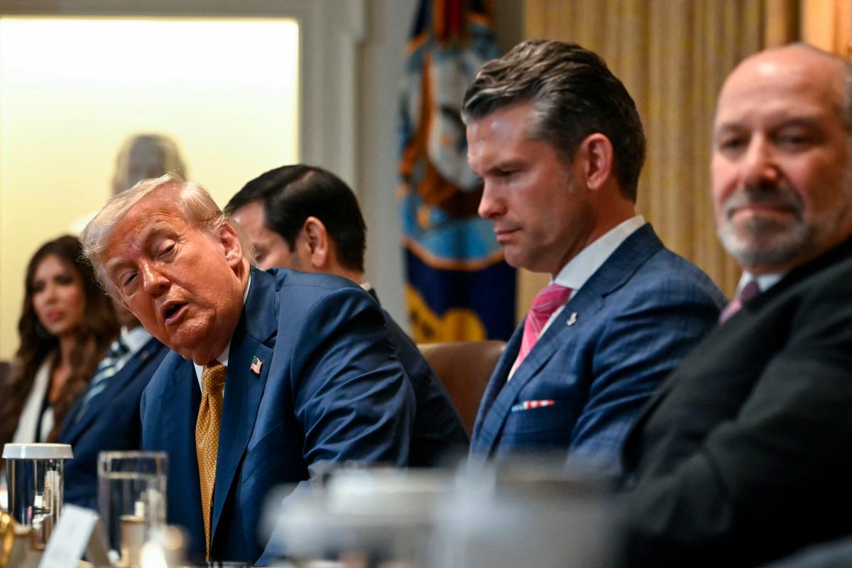 US President Donald Trump speaks alongside Secretary of Defence Pete Hegseth and Secretary of Commerce Howard Lutnick during a Cabinet meeting in the White House in Washington. – AFPPIC