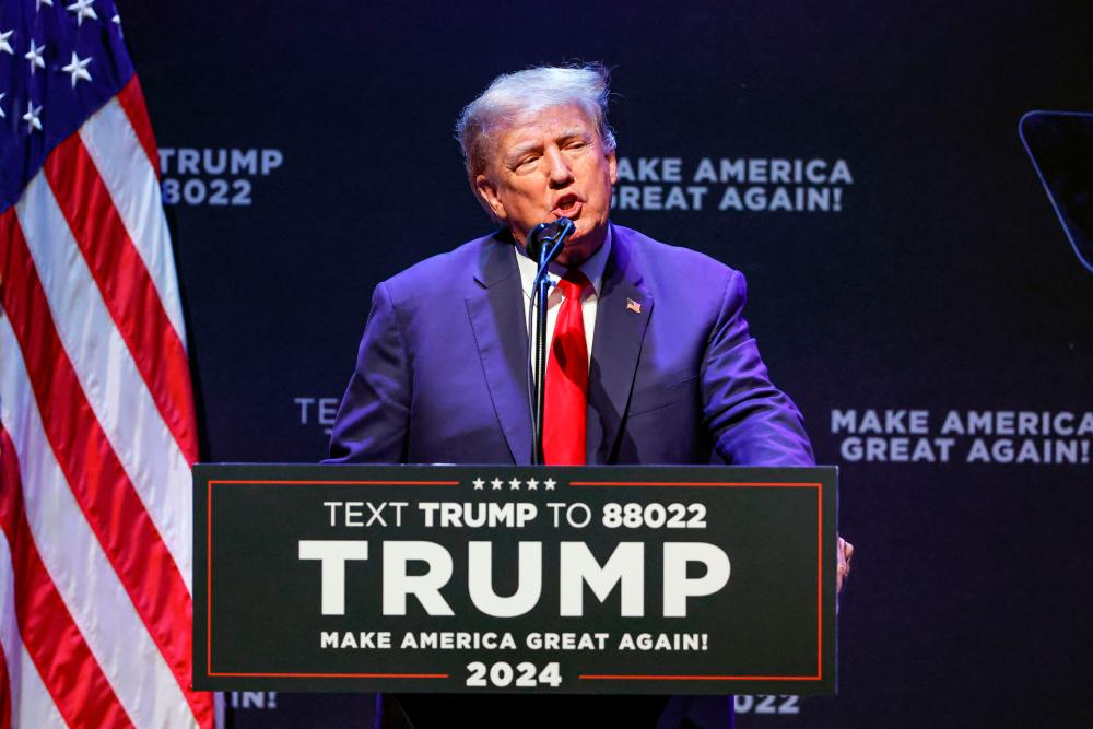 (FILES) Former US President Donald Trump speaks about education policy at the Adler Theatre in Davenport, Iowa on March 13, 2023. AFPPIX