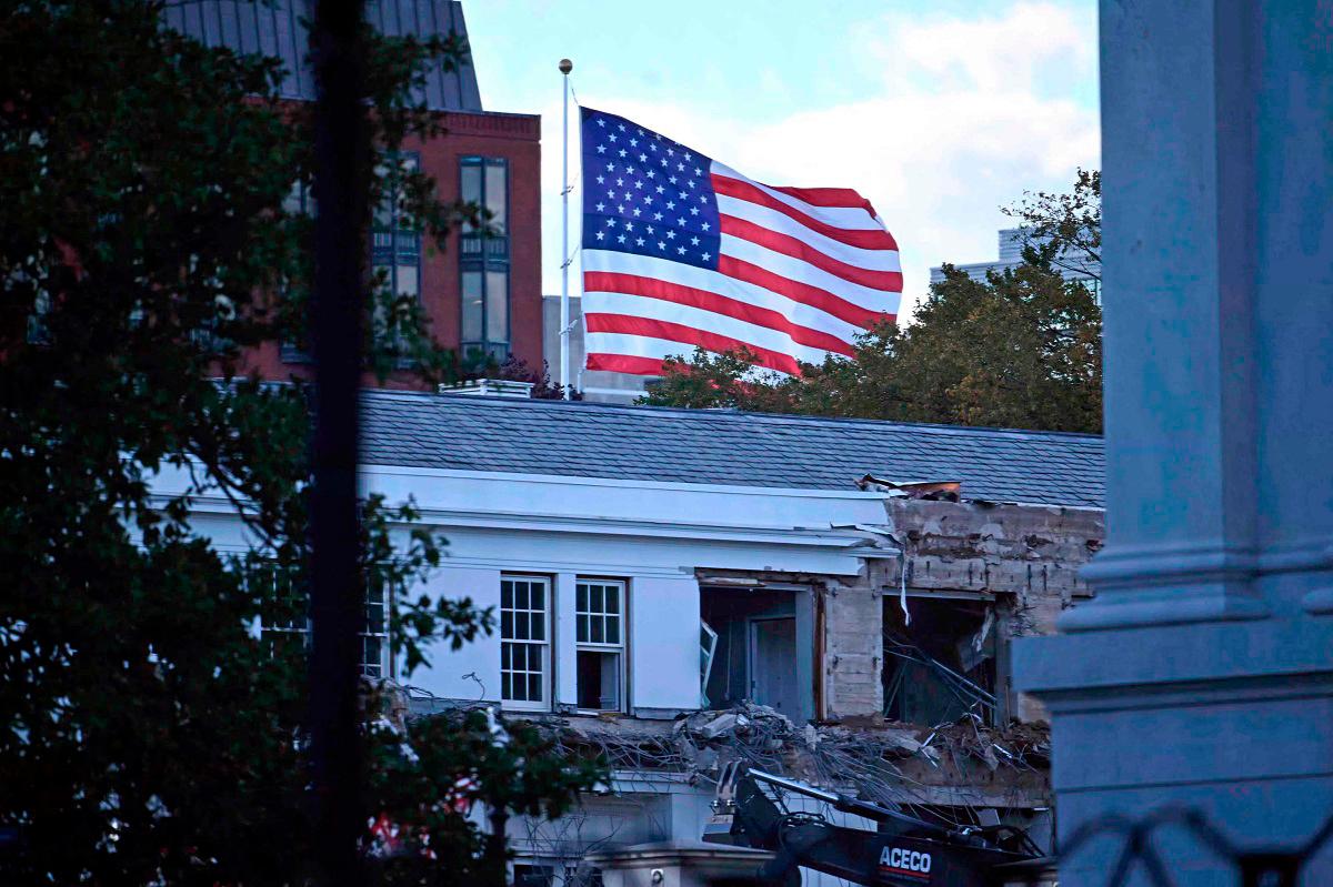 Heavy machinery tears down a section of the East Wing of the White House as construction begins on President Donald Trump’s planned ballroom, in Washington, DC, on October 20, 2025. - AFP