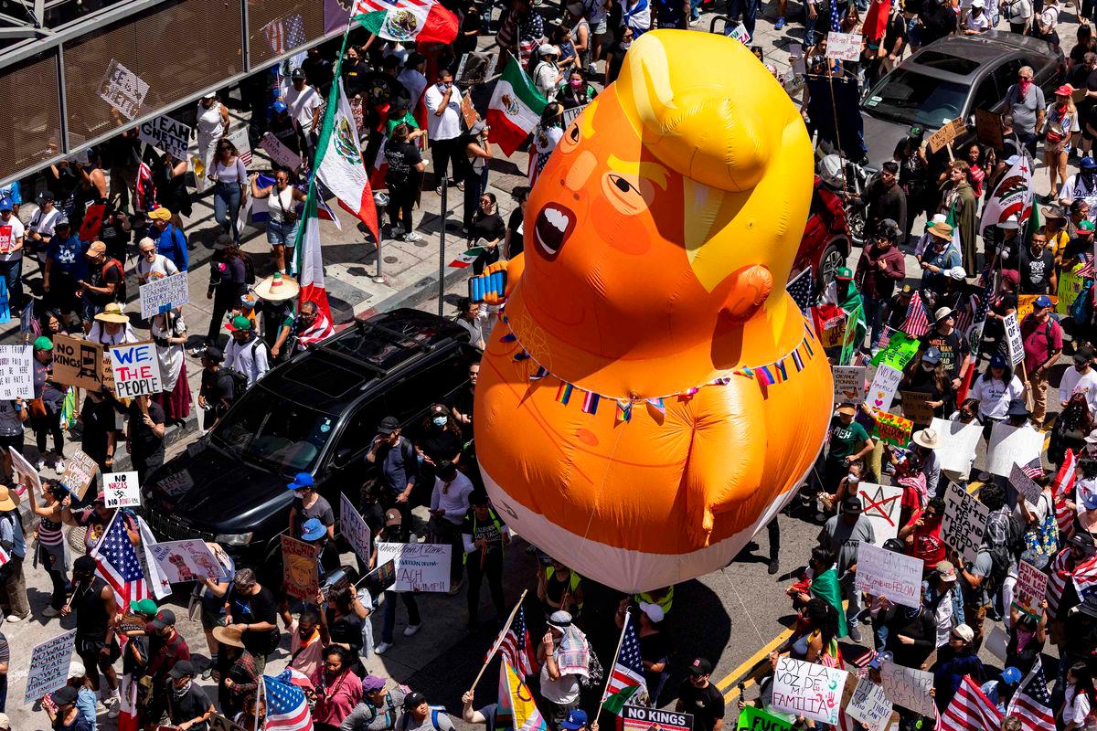 A 20-foot (6m)-tall balloon of US President Donald Trump in a diaper is seen among people taking part in a “No Kings” protest in Los Angeles, AFPpix