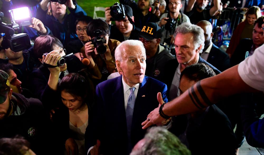 Democratic presidential hopeful former Vice President Joe Biden greets supporters as he leaves a Super Tuesday event in Los Angeles on March 3, 2020. - AFP