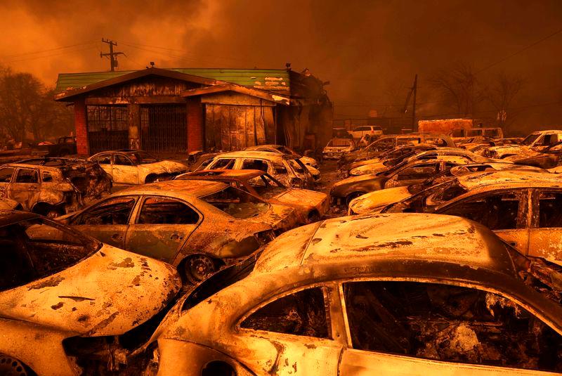 Cars destroyed by the Eaton Fire sit in the parking area of a burned auto shop on January 08, 2025 in Altadena, California. AFPpix