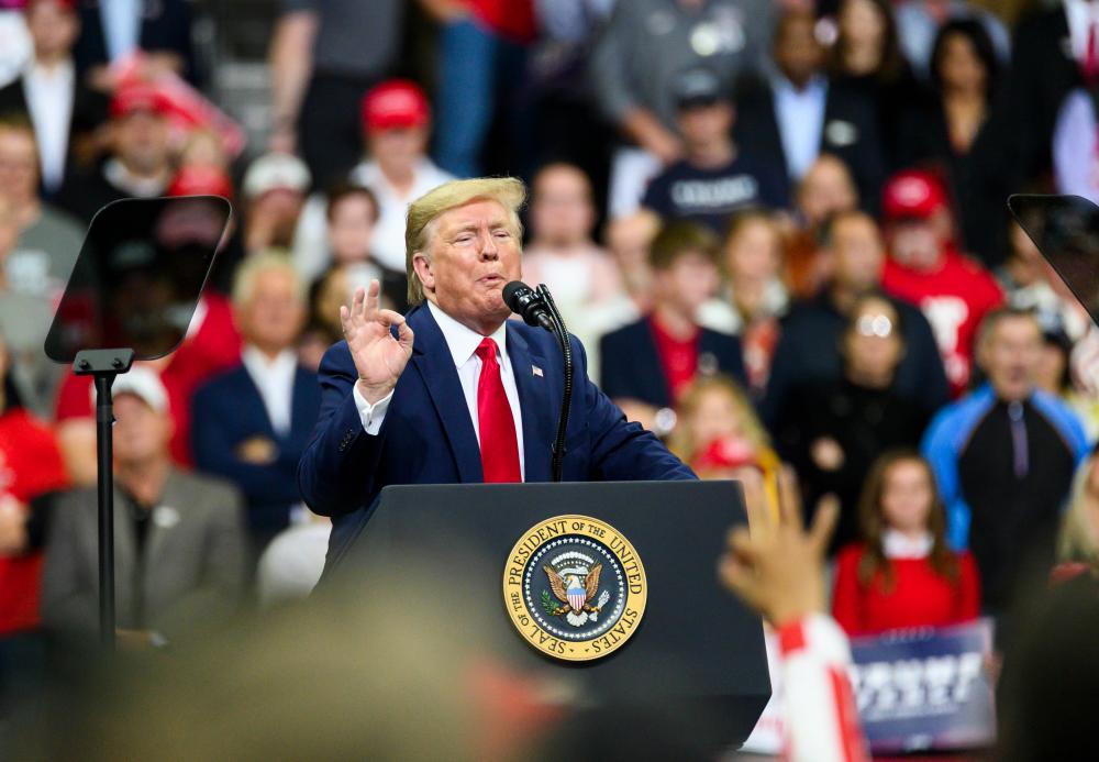 US President Donald Trump speaks on stage during a campaign rally at the Target Center on Oct 10, 2019, in Minneapolis, Minnesota. — AFP