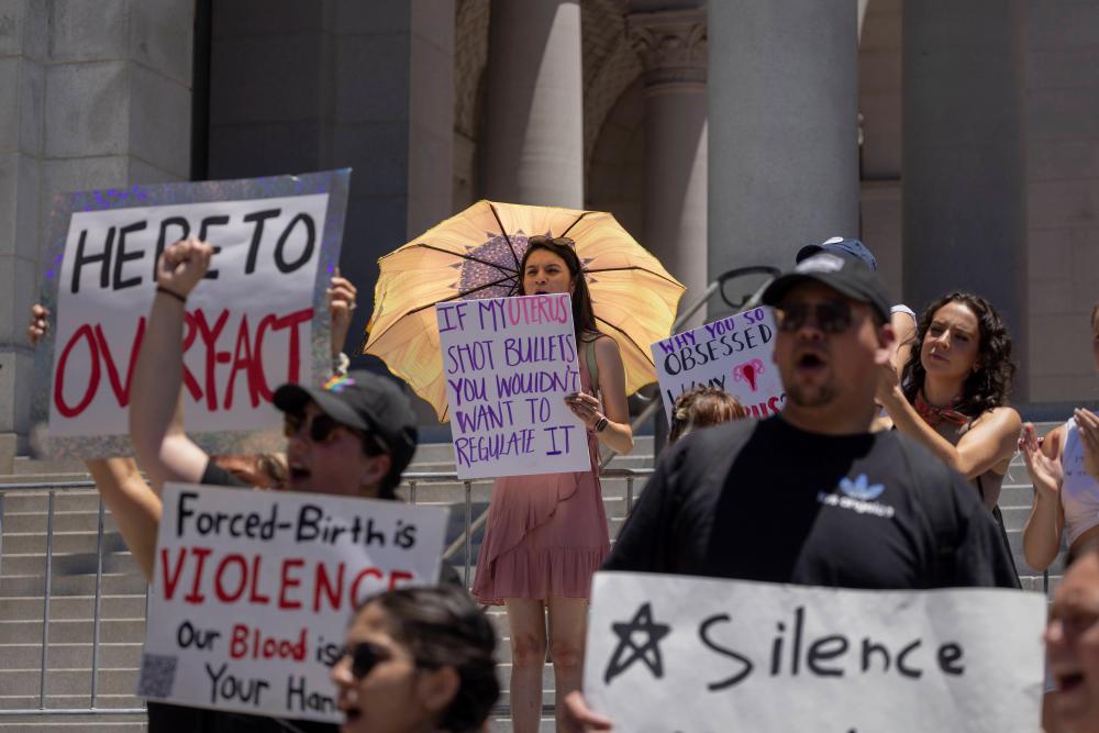LOS ANGELES, CA - JUNE 25: Protesters denounce the U.S. Supreme Court’s decision to end abortion rights protections at the steps of City Hall on June 25, 2022 in Los Angeles, California. AFPPIX