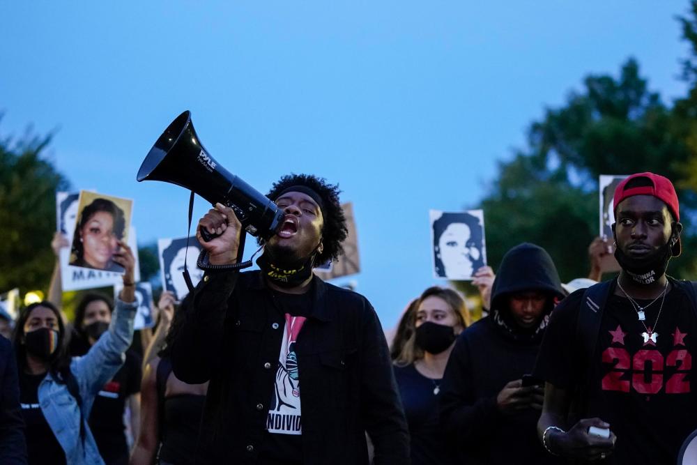 Demonstrators march along Constitution Avenue in protest following a Kentucky grand jury decision in the Breonna Taylor case on Sept 23, 2020 in Washington, D.C. — AFP