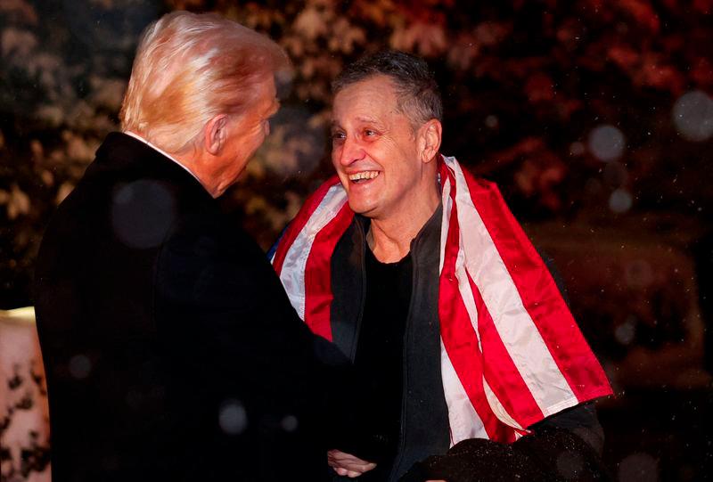 US President Donald Trump greets former detainee Marc Fogel as he arrives at the White House in Washington, DC, on February 11, 2025. - AFPPIX