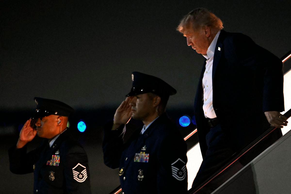 US President Donald Trump disembarks from Air Force One upon arrival at Joint Base Andrews in Maryland, on August 15, 2025- AFP