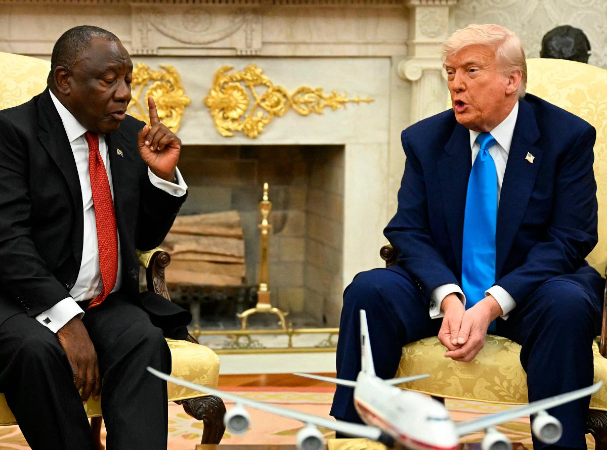 US President Donald Trump meets with South African President Cyril Ramaphosa in the Oval Office of the White House in Washington, DC, on May 21, 2025. South African President Cyril Ramaphosa meets Donald Trump on Wednesday amid tensions over Washington’s resettlement of white Afrikaners that the US president claims are the victims of “genocide.” - Jim WATSON / AFP
