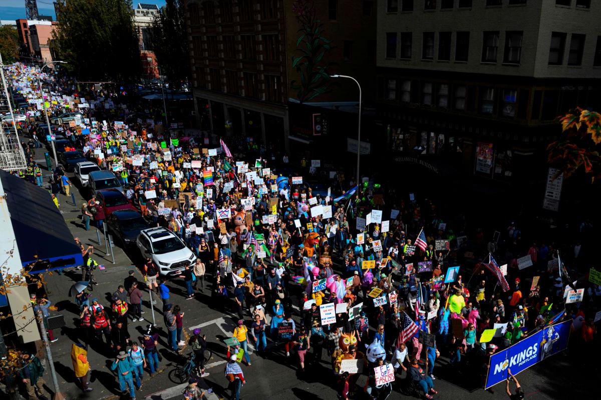 Demonstrators march through downtown Portland during the “No Kings” protest on October 18, 2025 in Portland, Oregon. - Mathieu Lewis-Rolland/Getty Images/AFP