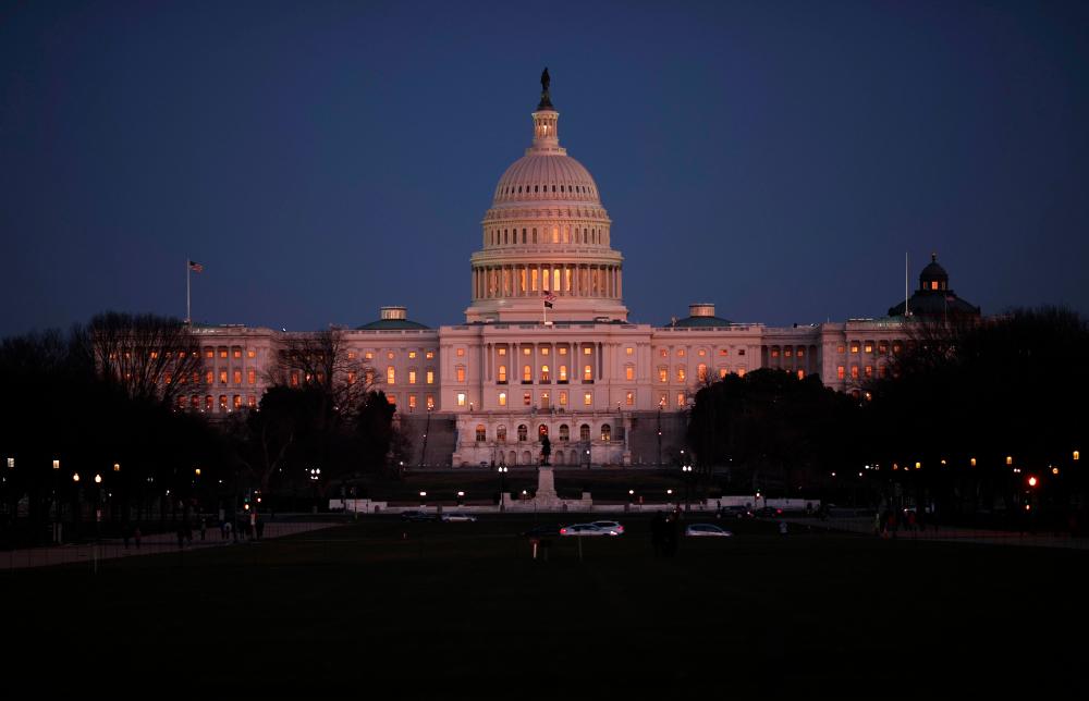 The US Capitol is shown at dusk as the US Senate begins the impeachment trial against US President Donald Trump on Jan 21, in Washington, DC. — AFP