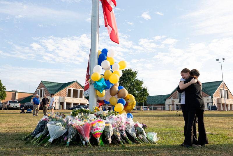 Students embrace near a makeshift memorial at Apalachee High School on September 5, 2024 in Winder, Georgia/AFPpix