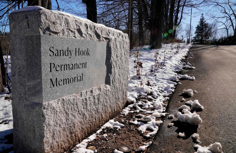 A plaque at the entrance to the The Sandy Hook Permanent Memorial in Newtown, Connecticut, on December 13, 2022/AFPPix