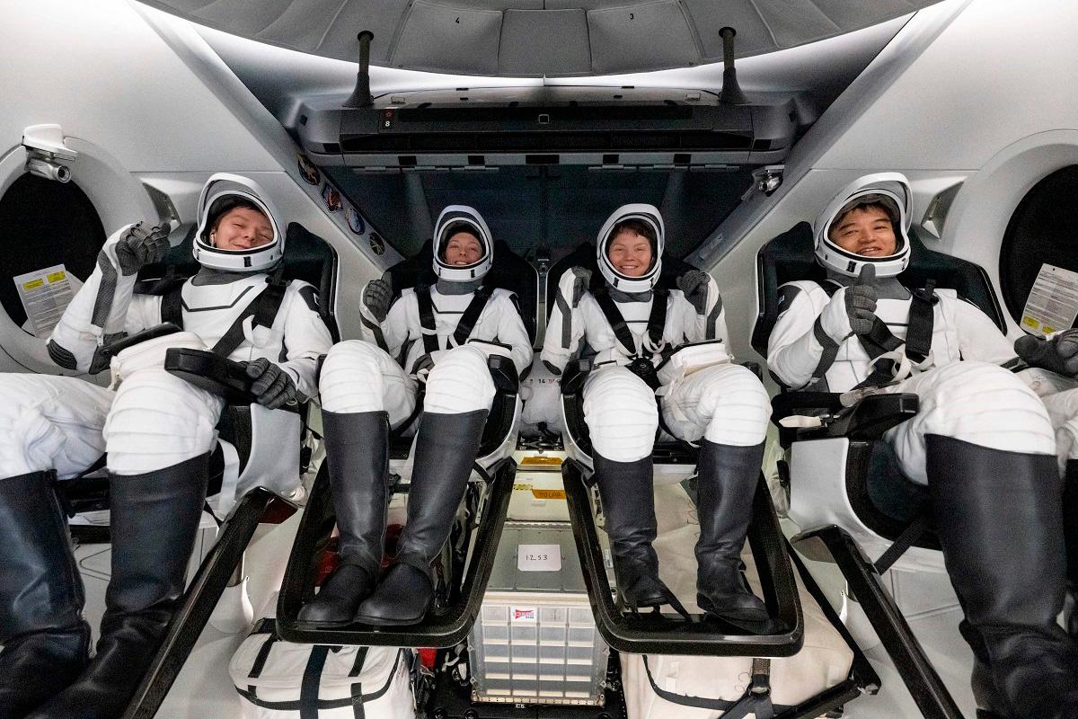 This picture provided by NASA shows, from L to R, Roscosmos cosmonaut Kirill Peskov, NASA astronauts Nichole Ayers, Anne McClain, and Japan Aerospace Exploration Agency (JAXA) astronaut Takuya Onishi inside the SpaceX Dragon Endurance spacecraft onboard the SpaceX recovery ship Shannon shortly after having landed in the Pacific Ocean off the coast of San Diego, California, on August 9, 2025. - AFP PHOTO / NASA / Keegan Barber