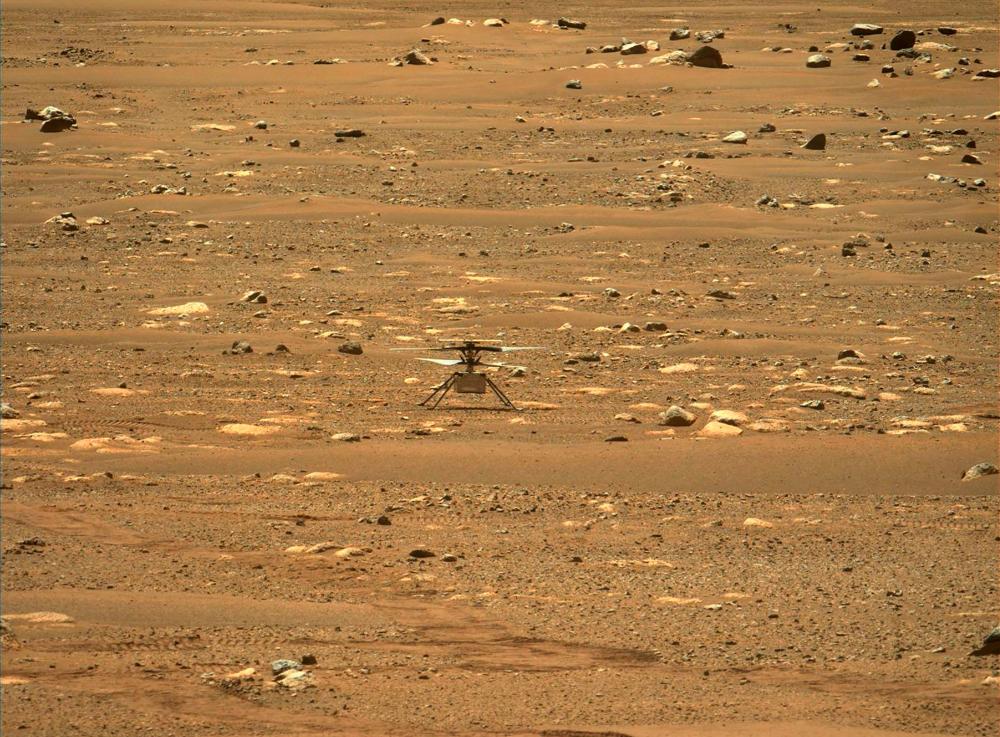 This NASA photo obtained on April 18, 2021 shows the agency's Ingenuity Mars Helicopter right after it successfully completed a high-speed spin-up test, captured by the Mastcam-Z instrument on Perseverance on April 16, 2021 (the 55th sol, or Martian day, of the rover's mission). –AFP