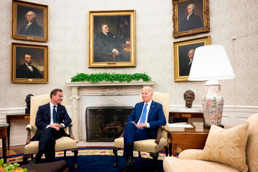 US President Joe Biden meets with Swedish Prime Minister Ulf Kristersson in the Oval Office of the White House in Washington, DC, on July 5, 2023. Biden is hosting Kristersson to discuss transatlantic security cooperation and the war in Ukraine, the White House said July 1. (Photo by Brendan Smialowski / AFP)