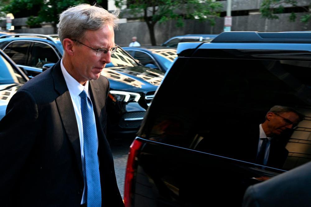 Schmidtlein departing the E. Barrett Prettyman Courthouse in Washington on Tuesday, Sept 12. – AFPpic