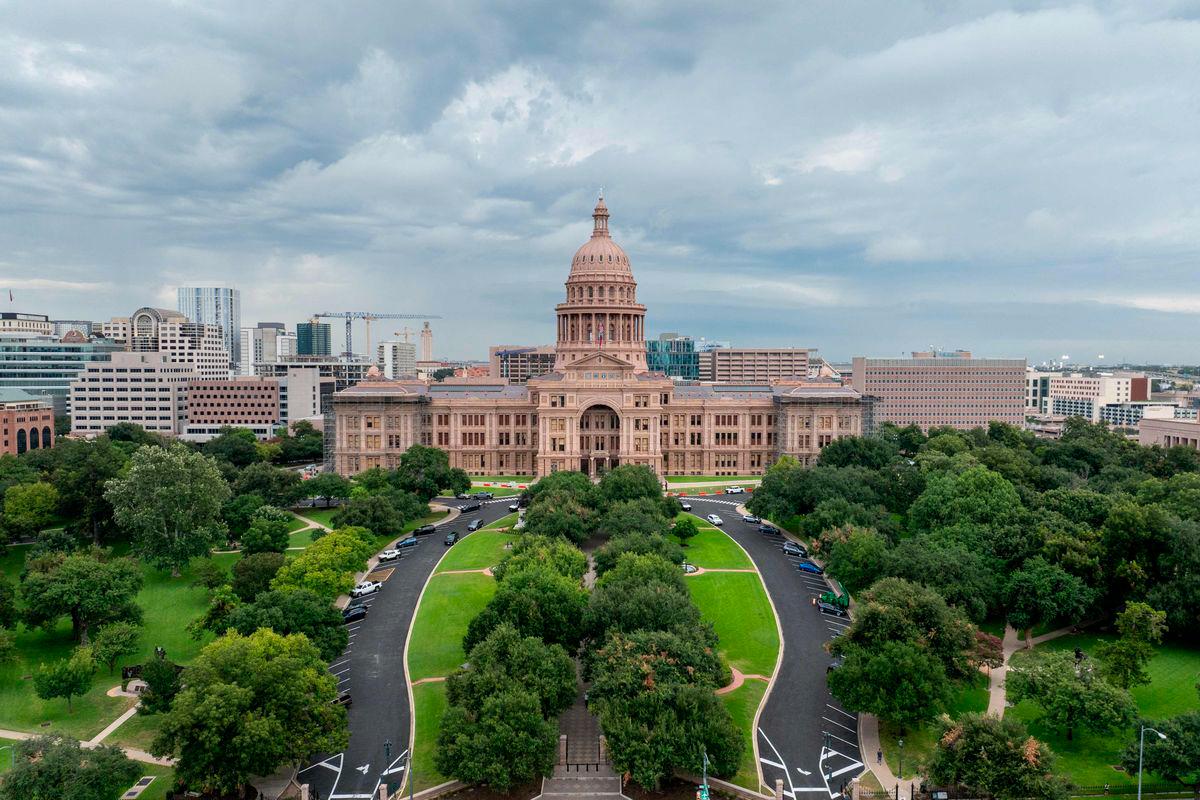 In an aerial view, the Texas Capitol is seen on August 04, 2025 in Austin, Texas. Texas Democratic lawmakers have fled the state in an attempt to protest and deny the newly proposed Republican redistricting plan. Gov. Greg Abbott has threatened to remove lawmakers who do not return by today. - Brandon Bell/Getty Images/AFPPIX
