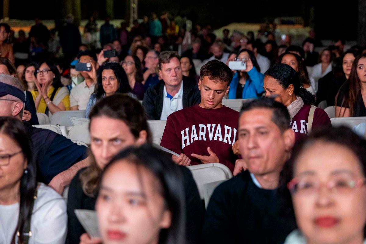 People watch as the Harvard Glee Club and Harvard University Band perform during a concert at Harvard Yard on May 27, 2025 in Cambridge, Massachusetts. AFPpix