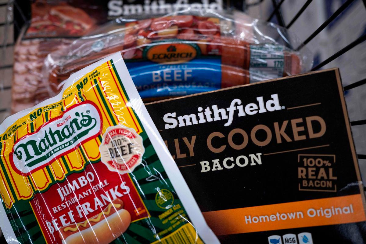 In this photo illustration, meat products by Smithfield Foods are offered for sale at a grocery store - Photo by SCOTT OLSON / GETTY IMAGES NORTH AMERICA / AFP