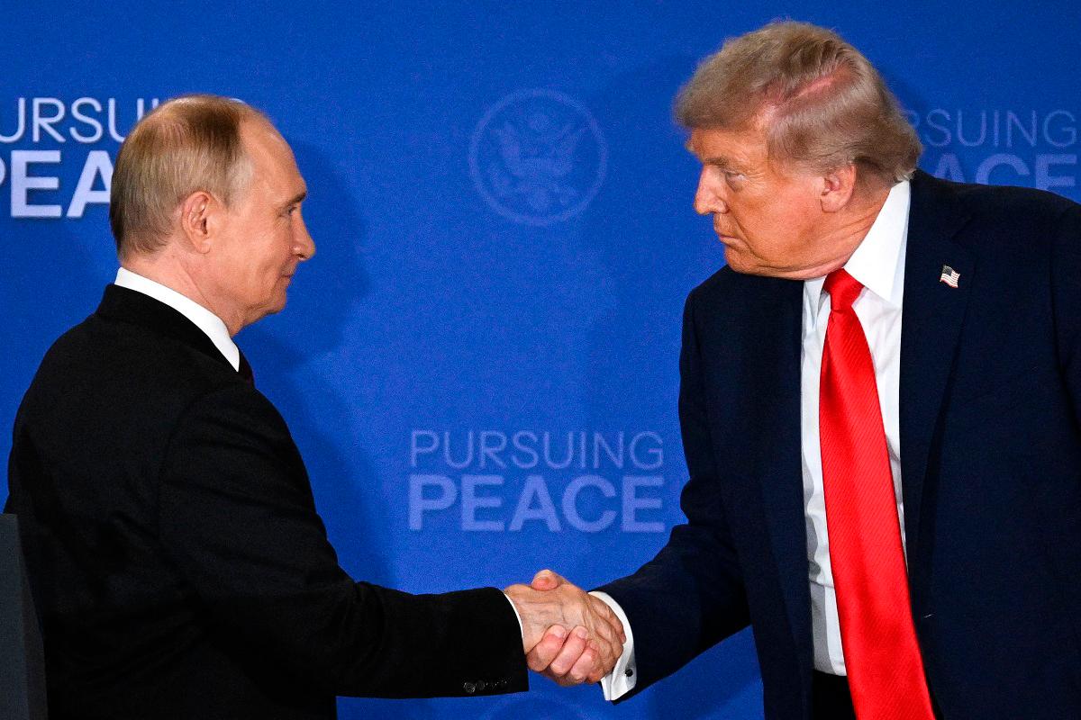 US President Donald Trump (R) and Russian President Vladimir Putin shake hands at the end of a joint press conference after participating in a US-Russia summit on Ukraine at Joint Base Elmendorf-Richardson in Anchorage, Alaska, on August 15, 2025. - Drew ANGERER / AFP