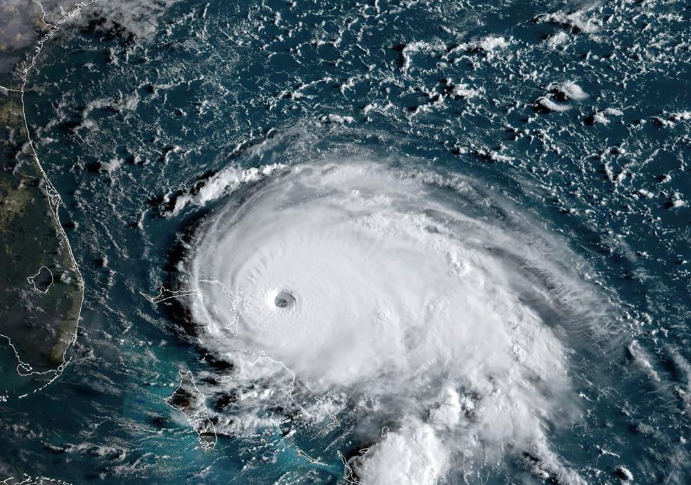 This satellite image obtained from NOAA/RAMMB, shows Tropical Storm Dorian as it approaches the Bahamas and Florida at 12:00 UTC on September 1, 2019. - AFP