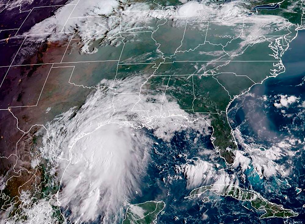 This RAMMB National Oceanic and Atmospheric Administration (NOAA) satellite handout image shows Tropical Storm Nicholas, off the coastline of the US state of Texas at 13H40 UTC on September 13, 2021. AFPpix