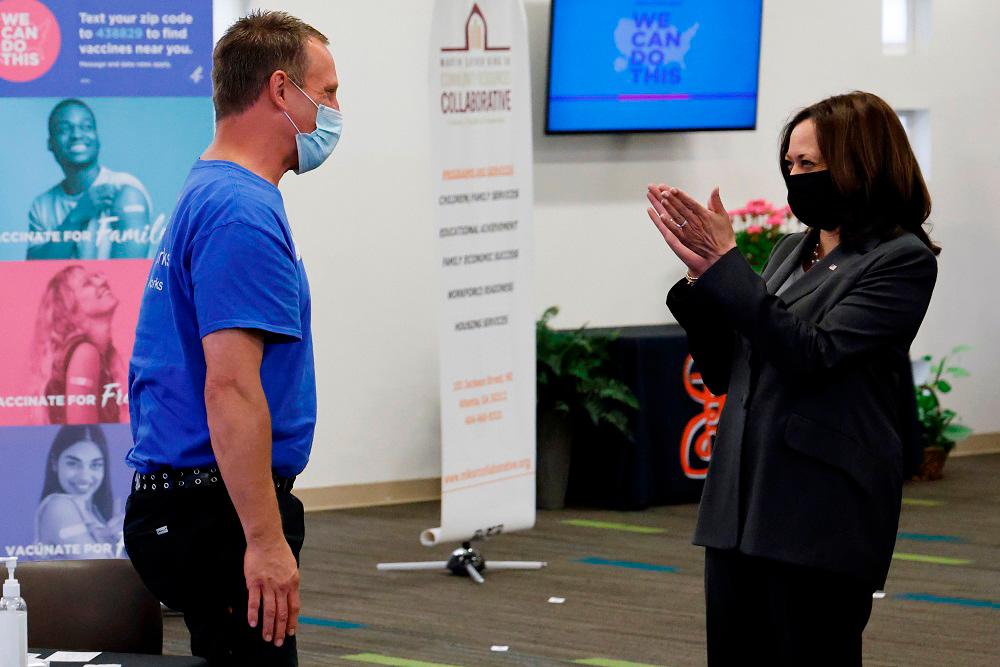 US Vice President Kamala Harris applauds a man after he received a shot at a pop-up Covid vaccination site at Ebenezer Baptist Church in Atlanta, Georgia on June 18, 2021. ― Reuters