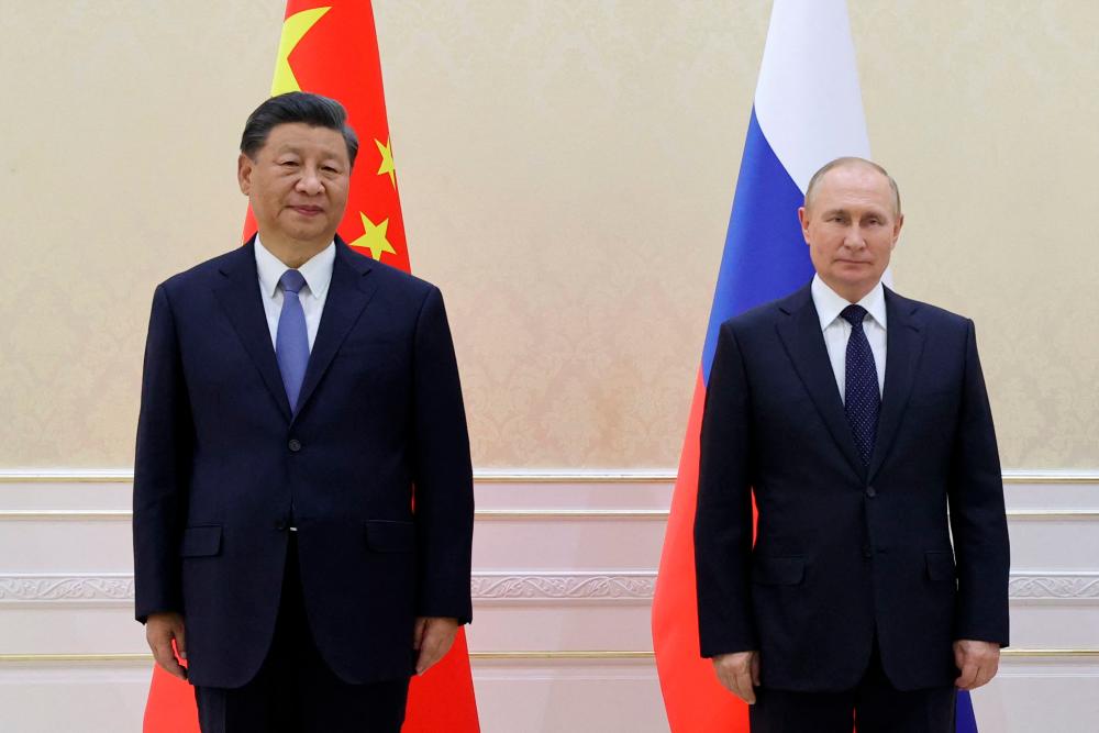 China’s President Xi Jinping and Russian President Vladimir Putin pose with Mongolia’s President during their trilateral meeting on the sidelines of the Shanghai Cooperation Organisation (SCO) leaders’ summit in Samarkand on September 15, 2022. AFPPIX