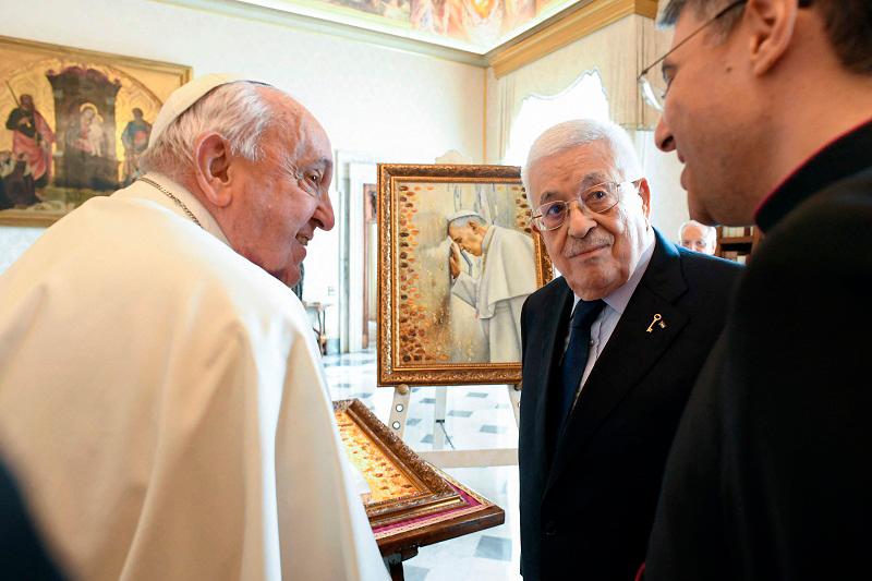 This photo taken and handout on December 12, 2024 by The Vatican Media shows Pope Francis during his private audience with Palestinian President Mahmud Abbas in The Vatican. - AFP PHOTO / VATICAN MEDIA