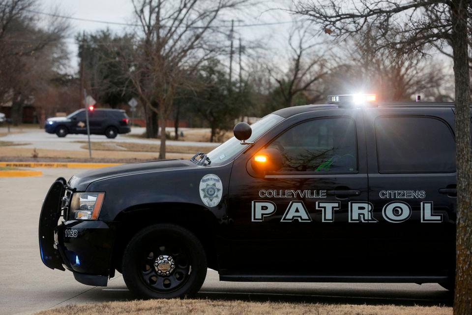 Law enforcement vehicles are seen in the area where a man has reportedly taken people hostage at a synagogue during services that were being streamed live, in Colleyville, Texas, U.S. January 15, 2022. REUTERSpix