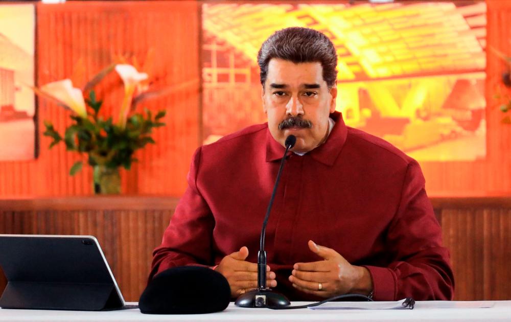 Handout picture released by the Venezuelan Presidency showing Venezuela’s President Nicolas Maduro speaking during a meeting with members of the National Board of the ruling United Socialist Party of Venezuela (PSUV), at the Humboldt hotel in Caracas on March 20, 2023. AFPPIX