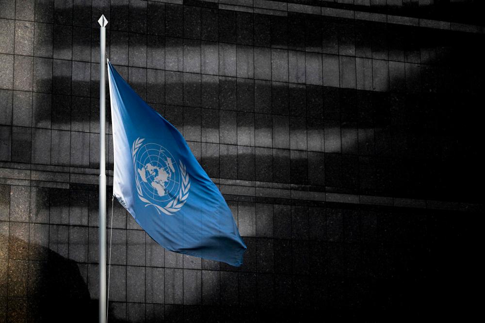 The United Nations flag waves outside the Technical Advisory Office of the United Nations High Commissioner for Human Rights headquarters in Caracas, on February 15, 2024/AFPPix