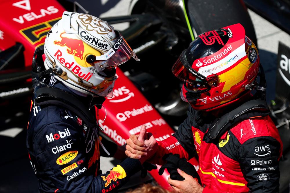 Race winner Max Verstappen of the Netherlands and Oracle Red Bull Racing talks with Second placed Carlos Sainz of Spain and Ferrari in parc ferme during the F1 Grand Prix of Canada at Circuit Gilles Villeneuve on June 19, 2022 in Montreal, Quebec. AFPpix