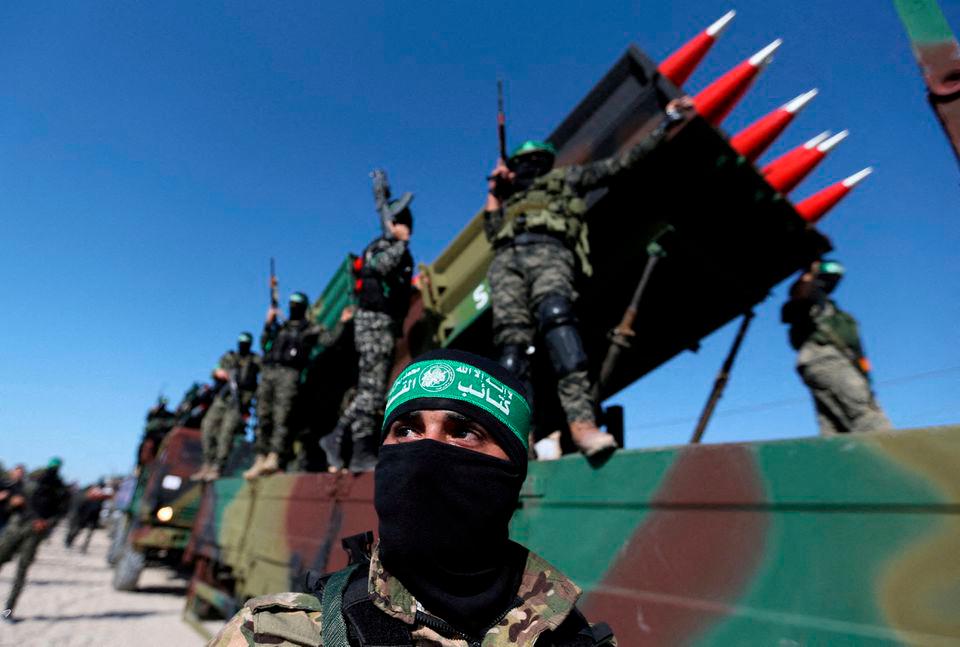 Palestinian Hamas militants attend an anti-Israel rally in Khan Younis, in the southern Gaza Strip May 27, 2021. REUTERSPIX
