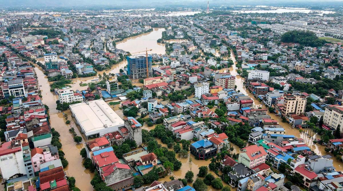 Floodwaters inundating residential areas after heavy rains brought by Typhoon Matmo in Thai Nguyen city on October 8, 2025. (Photo by AFP)