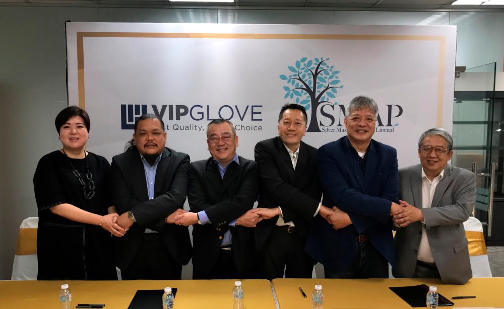 (From left) VIP Gloves major shareholder Jennifer, managing director Jimmy Yang, Chen, chairman Dr Joe Wong, Silver Max directors Alfonso Chu and Perway Yu