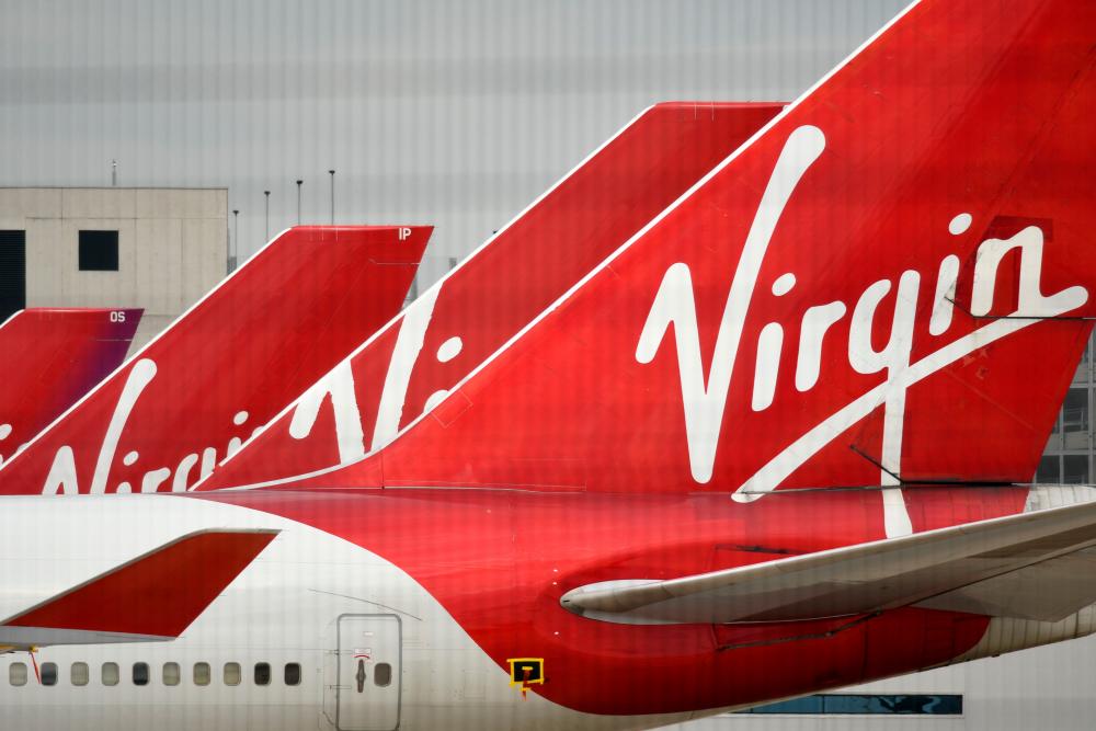 Virgin Atlantic Airline planes are pictured at the apron at Manchester Airport, England. – AFPPIX