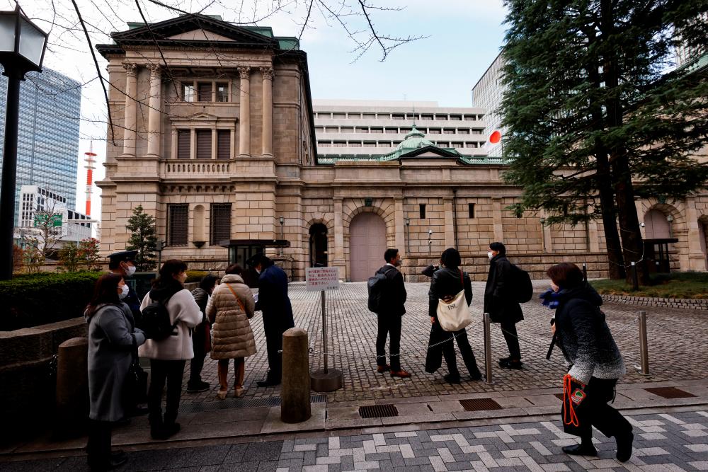 Visitors are seen at the headquarters of Bank of Japan in Tokyo on Tuesday. – Reuterspic