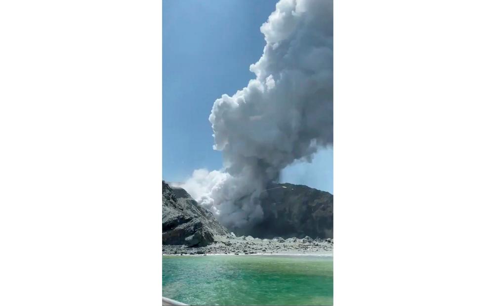 Thick smoke from the volcanic eruption of Whakaari, also known as White Island, is seen from a distance of a vessel in New Zealand, Dec 9, in this image obtained via social media. — Reuters