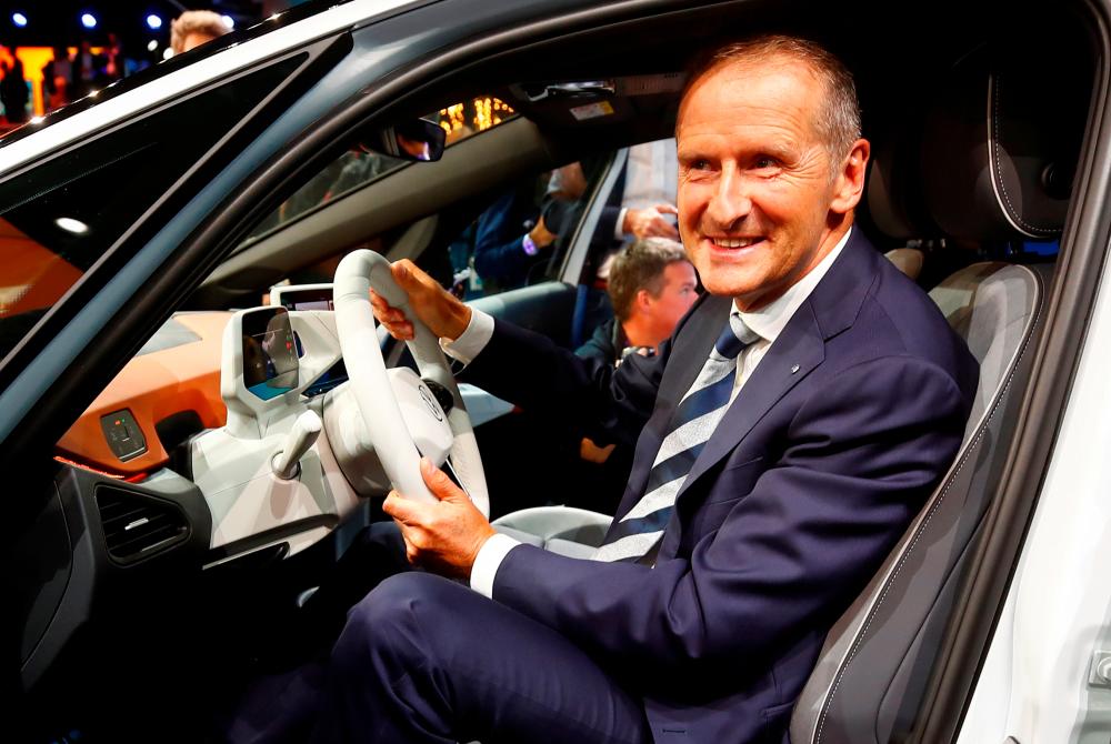 Diess posing in an ID.3 preproduction prototype during the presentation of Volkswagen’s new electric car on the eve of the International Frankfurt Motor Show IAA on Sept 9, 2019. – REUTERSPIX