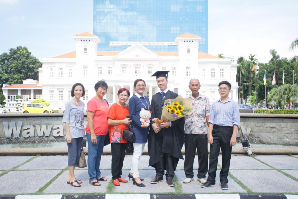 Special graduate Low with his family on graduation day.