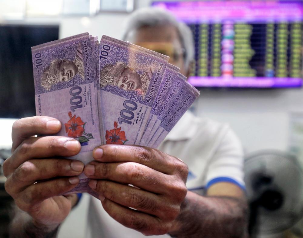 Kuperan said the outflow of cash via remittances sent to Malaysians studying abroad also adds to pressure on the ringgit. – SUNPIC