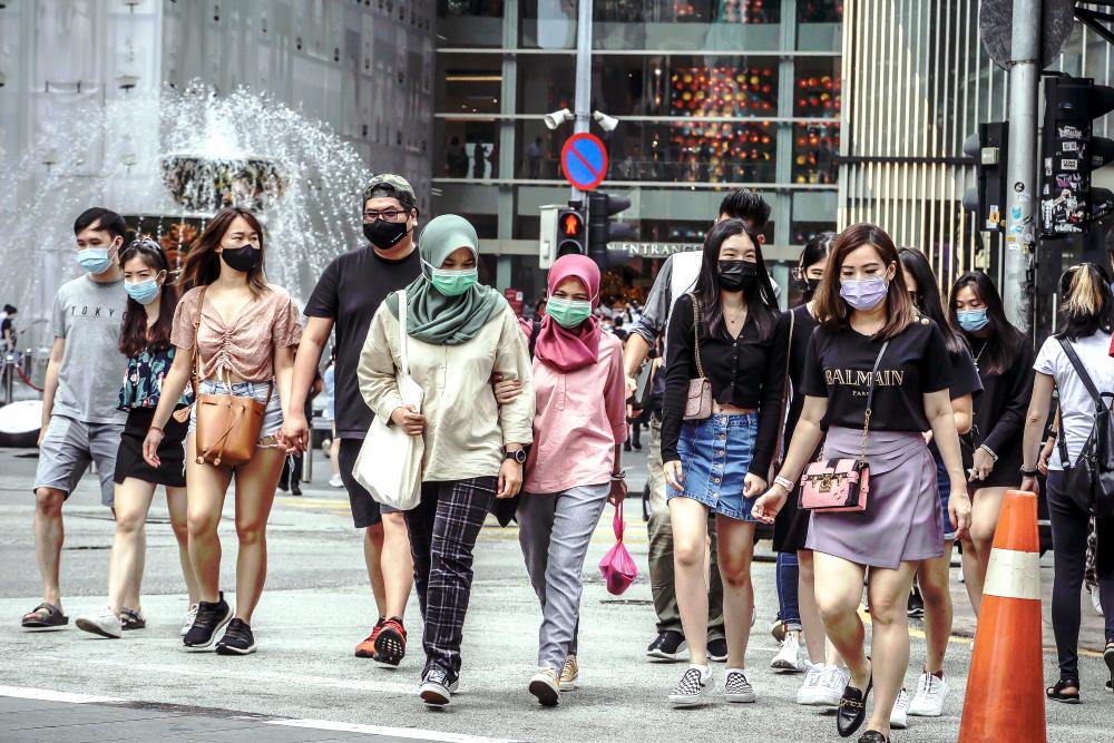 The Health DG has advised the public to wear face masks both indoors and outdoors to avoid getting infected. – ADIB RAWI YAHYA/THESUN