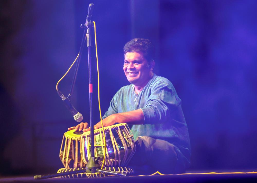Visually-impaired musician R. Chandru mesmerising the audience with his ‘tabla’ (percussion) playing skills at the Deepavali event. – AMIRUL SYAFIQ/THESUN