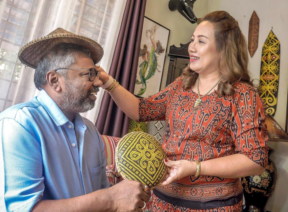 Adison and Lulie at their home in Subang Bestari, Selangor. – ADIB RAWI YAHYA/THESUN