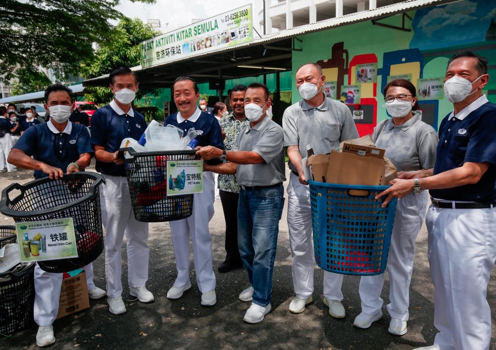 Tan (third, left) with foundation members at the launch of its recycling station at the Bukit Jalil Golf and Country Resort on Sunday. Hafiz Sohaimi/THESUNpix