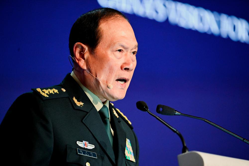 China's State Councilor and Defence Minister General Wei Fenghe speaks at a plenary session during the 19th Shangri-La Dialogue in Singapore June 12, 2022. REUTERSpix