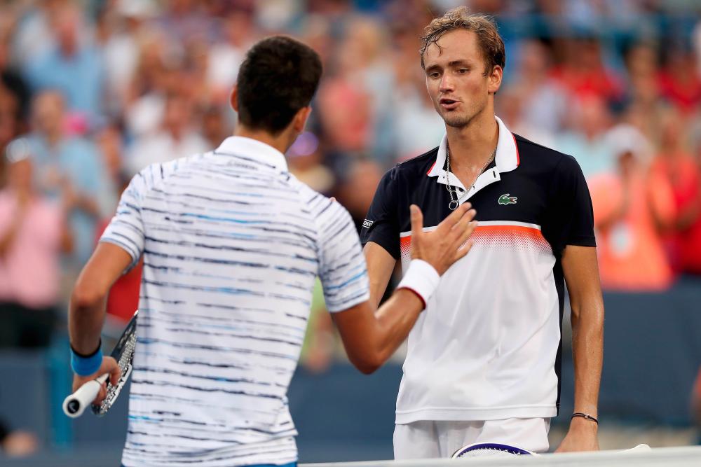 Novak Djokovic of Serbia congratulates Daniil Medvedev of Russia after their match during the Western &amp; Southern Open at Lindner Family Tennis Center on Aug 17, 2019 in Mason, Ohio. - AFP